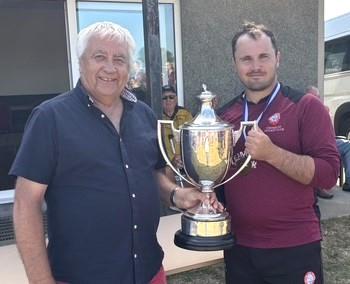Tom Arthur receives the magnificent trophy from Graham Morris Tom Arthur receives the magnificent trophy from Graham Morris
